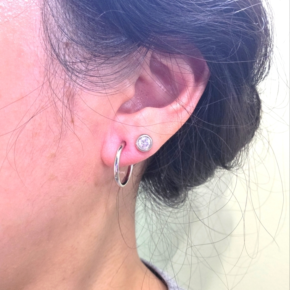 Silver toned puffy hoop huggie clip on no piercing retractable comfort Earrings